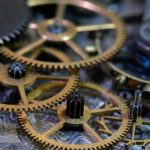 Close-up of intricate vintage gears interlocking in a mechanical assembly