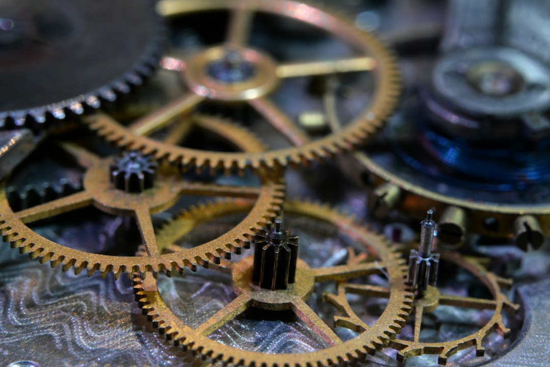 Close-up of intricate vintage gears interlocking in a mechanical assembly